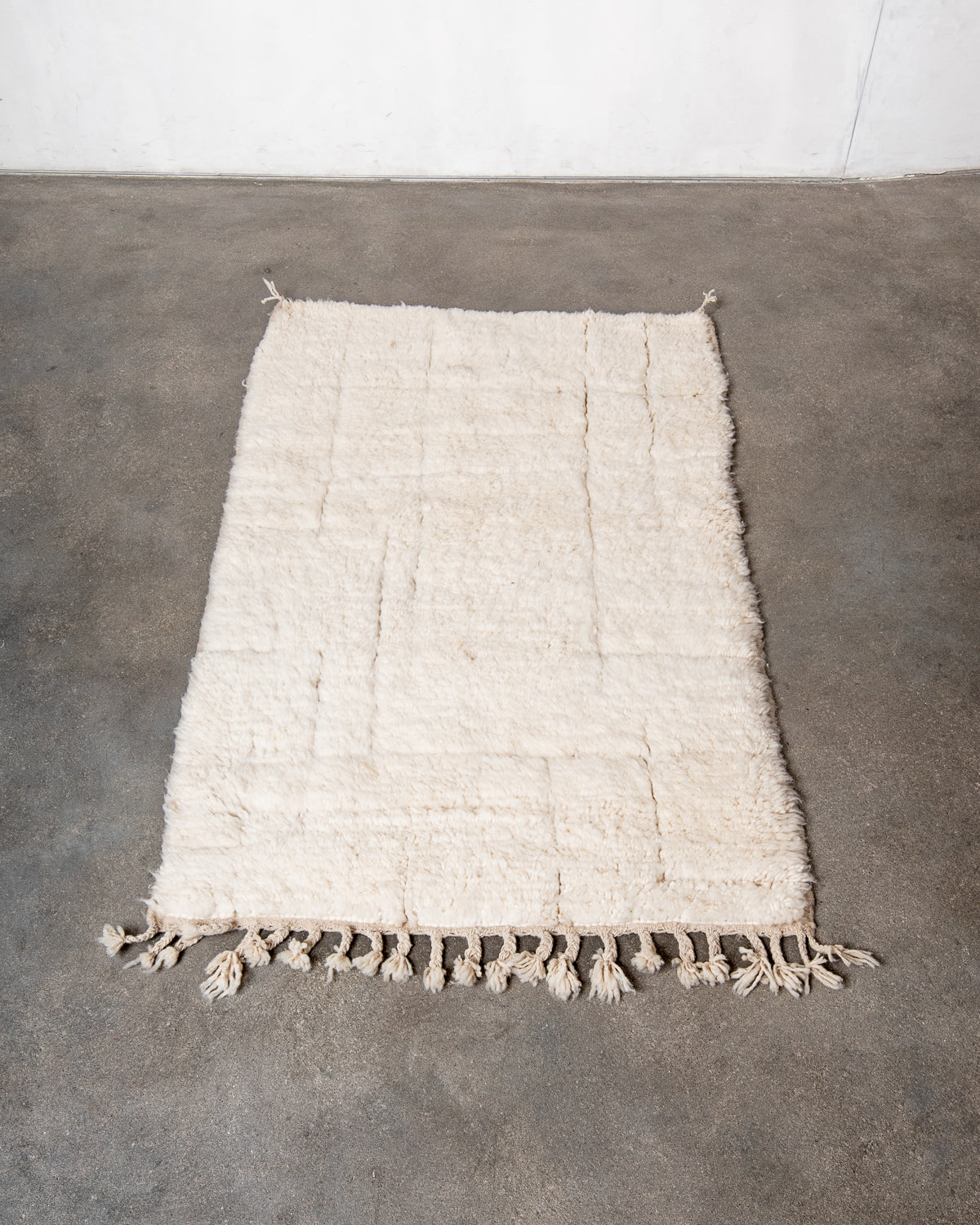 Modern, designer, handcrafted Berber rug from Morocco. Beniourain carpet with minimalist design, natural wool pile and a fluffy texture.
